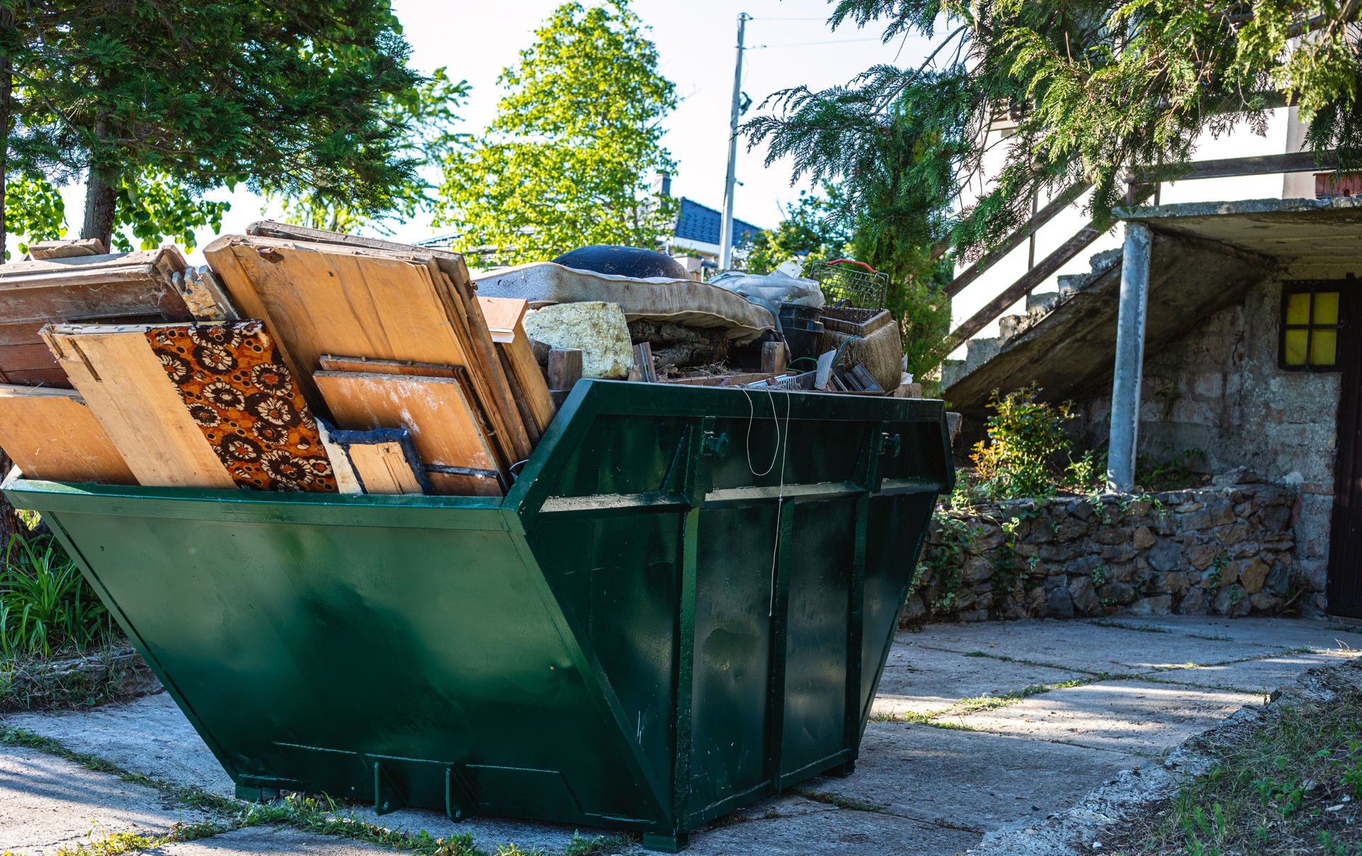 Dumpster full of bulky garbage